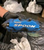 4 pot spoon caliper set with brake pads and brake rotors.